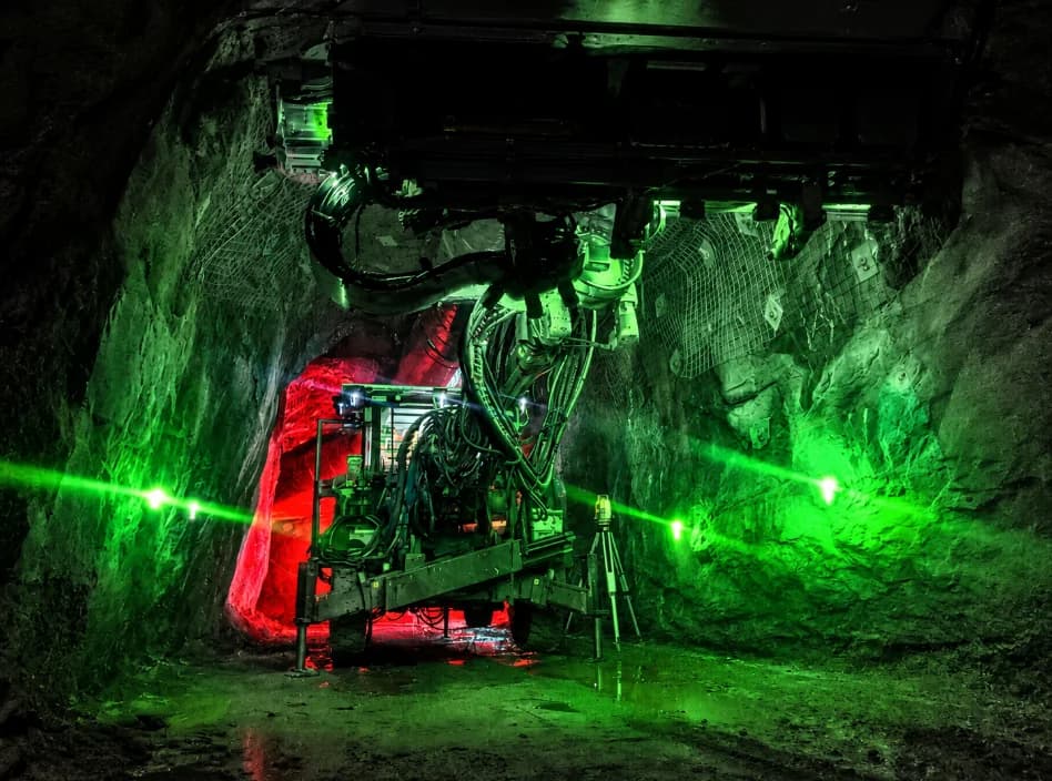 OptiClino lasers projecting alignment lines from a longhole drill rig underground